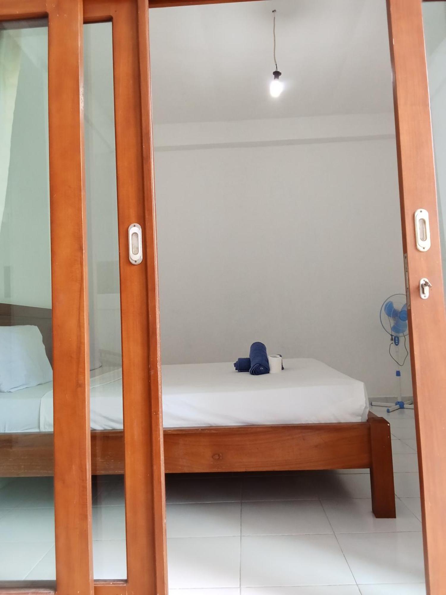 Komang Homestay Амед Экстерьер фото